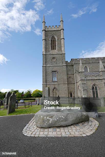 St Patricks Traditional Grave With Cathedral Tower Behind Stock Photo - Download Image Now
