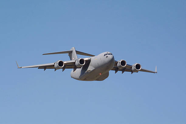 C-17 Globemaster III Flyby US Airforce C-17 Long-range heavy transport aircraft. us air force photos stock pictures, royalty-free photos & images