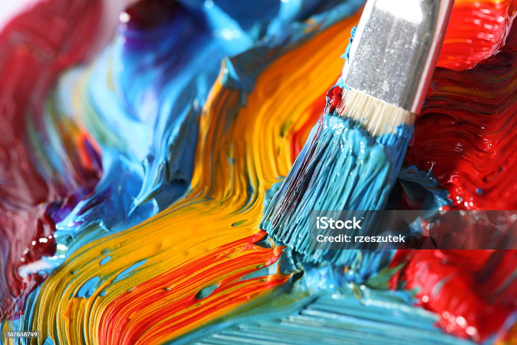 mixed oil paint with paintbrush well mixed oil paint with paintbrush Paint Stock Photo
