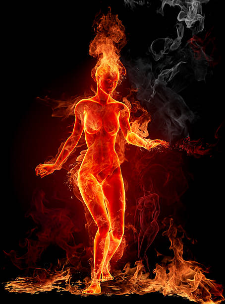 Silhouette of a woman made with fire stock photo