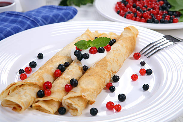 istock Pancakes with cream and fruits 147648980
