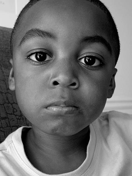 Close-Up Portrait Of Girl Against Black Background