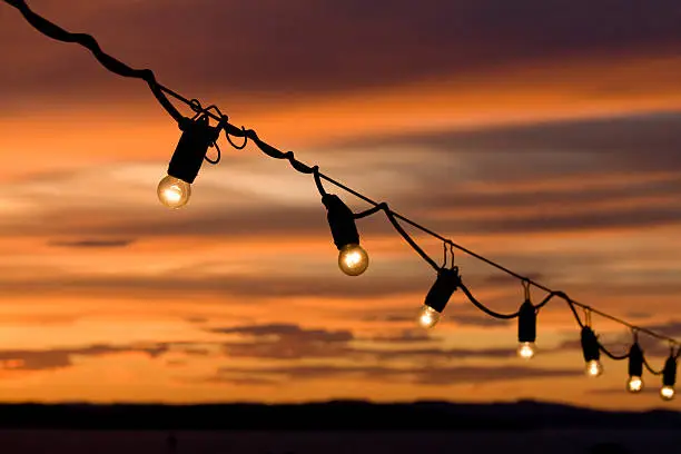 Small party lights with a colorful sunset at the background.