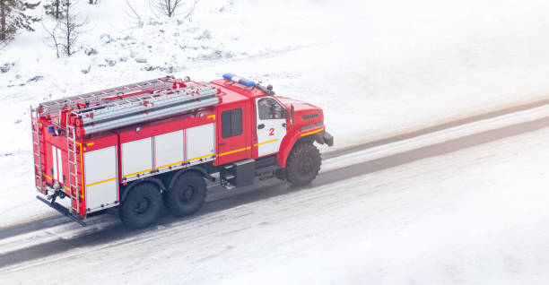 istock A red fire truck or Fire engine drives down a snowy street in winter 1476509393