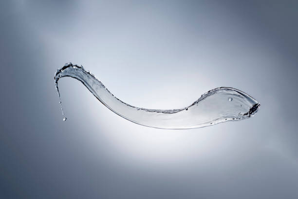 istock Abstract Splash of Water on a Blue Background 1476511192
