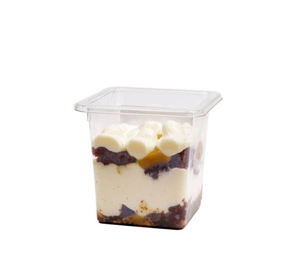 istock Portion of chocolate caramel mousse in a plastic cup on a white background. 1476513612