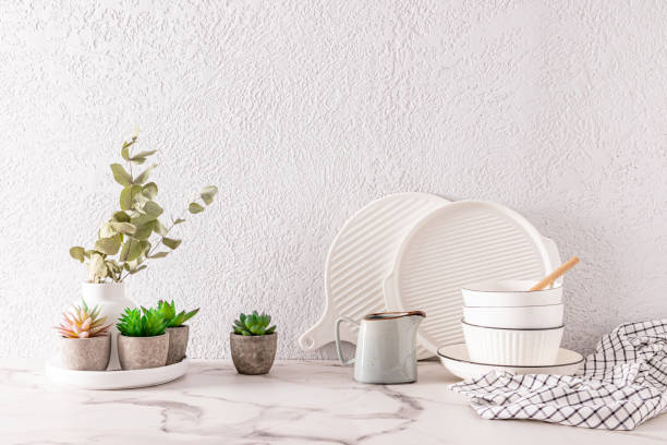 istock Beautiful kitchen background with various eco-friendly utensils and plants in pots and vases. front view. grey cement wall. a copy space. 1476514068
