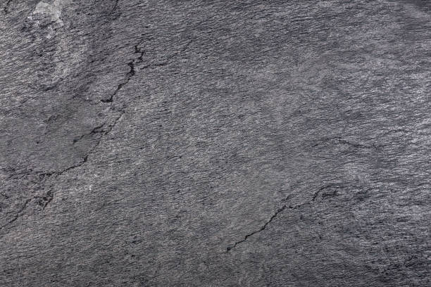 istock natural stone texture, QUARZITE BEOLA NERA slab, gray color with various cracks 1476531304