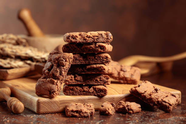 istock Brownie with mint on an old table with kitchen utensils. 1476537296