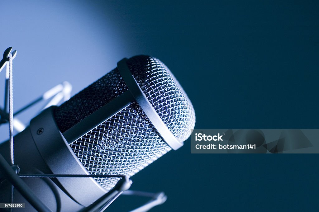 Microphone in studio. Microphone in studio. Dark blue light. Broadcasting Stock Photo