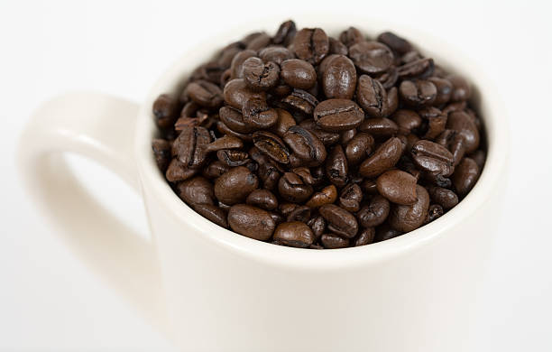 Coffee Beans in White Mug stock photo