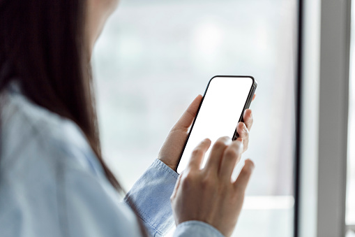 Smartphone mockup. Closeup of woman using mobile phone