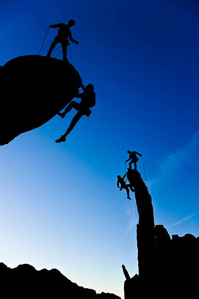 istock Team of climbers reaching the summit. 147655242