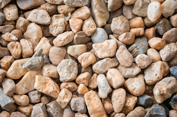 Full frame shot of gravel texture and background used for decoration or design garden. Gravel is rock that is of a certain particle size range. stone wall stone wall crag stock pictures, royalty-free photos & images