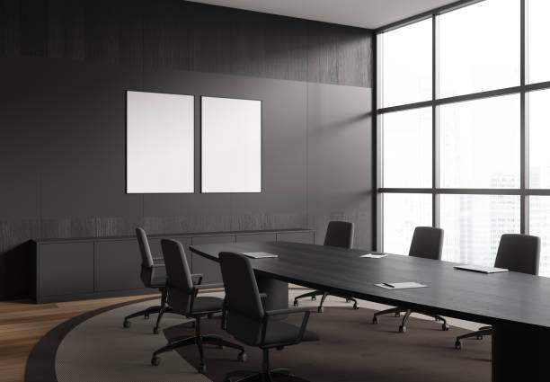 istock Corner view on dark office room interior with two posters 1476553998