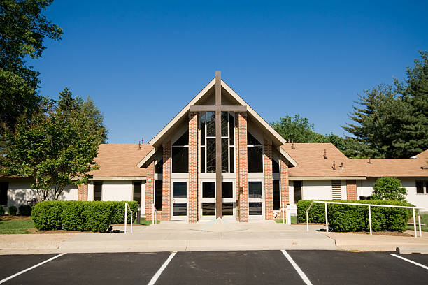 Exterior Modern Church A-Frame Gabled Roof, Metal Cross stock photo