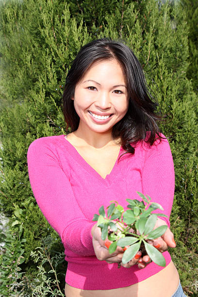 Asian Woman and New Growth stock photo