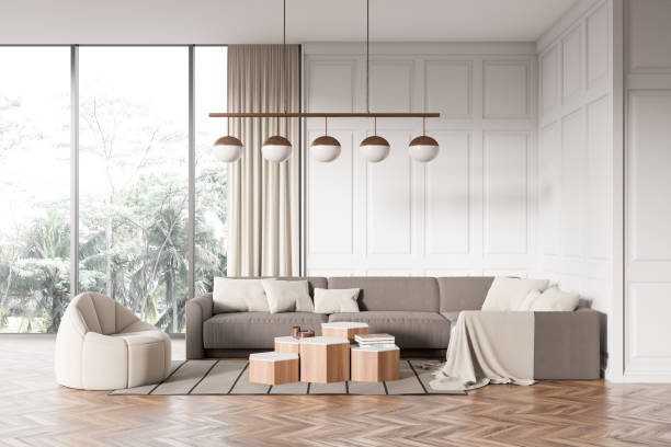 istock Stylish living room interior with couch and coffee table, panoramic window 1476561402