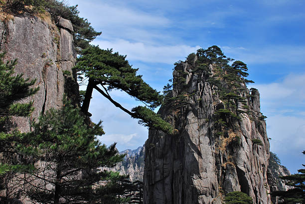 istock Precipitous mountain peak and blue color sky 147656282