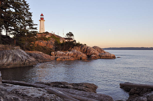 istock point atkinson lighthouse at sunset and moonrise 147656289
