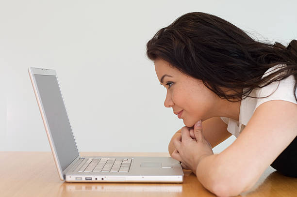 Woman with laptop stock photo