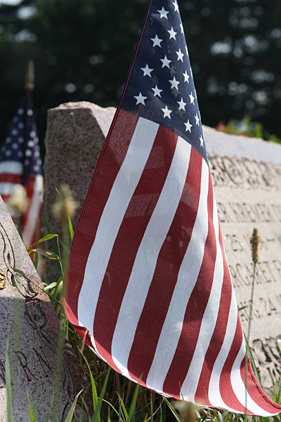 istock American Flag on Veteran's Grave 147656367