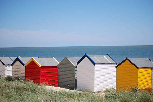 istock Row of brightly voloured beach huts 147657158