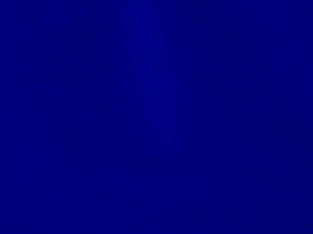 istock Blue velvet fabric texture used as background. Empty blue fabric background of soft and smooth textile material. There is space for text. 1476573490