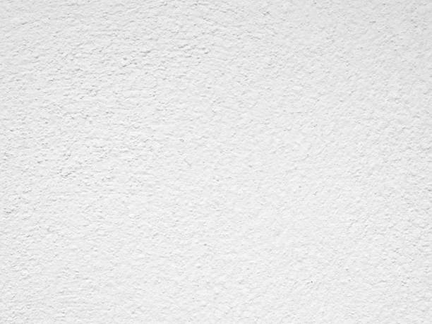 istock Seamless texture of white cement wall a rough surface, with space for text, for a background.. 1476573506