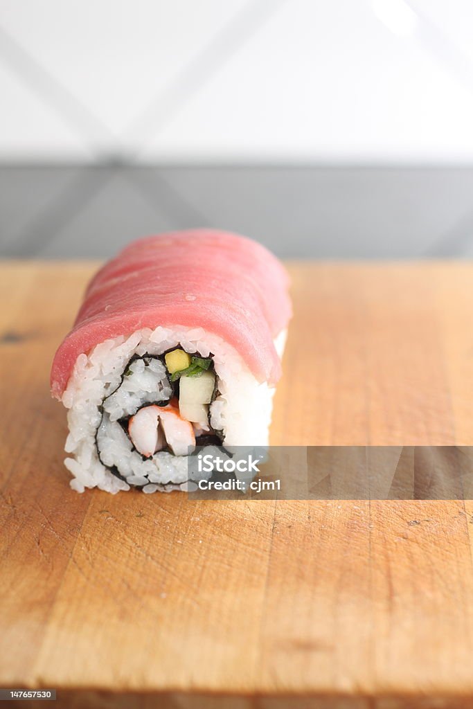 Tuna and Shrimp Sushi Roll a shrimp sushi roll with thinly sliced ahi tuna layed over the top. Asia Stock Photo