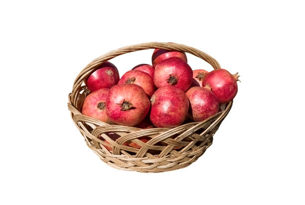 istock Group of pomegranates isolated on white background. Pomegranate closeup pattern. 1476576825