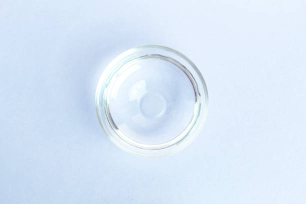 istock A bowl of water on a blue background. home stuff. 1476578717