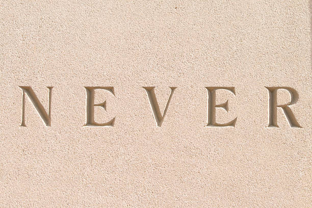 istock Word "Never" Carved in Sandstone 147658002