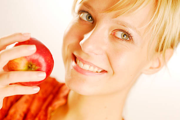 Girl with an apple stock photo