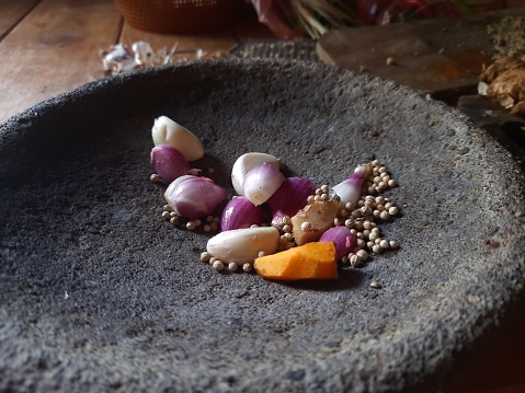 some food seasonings on a stone mortar