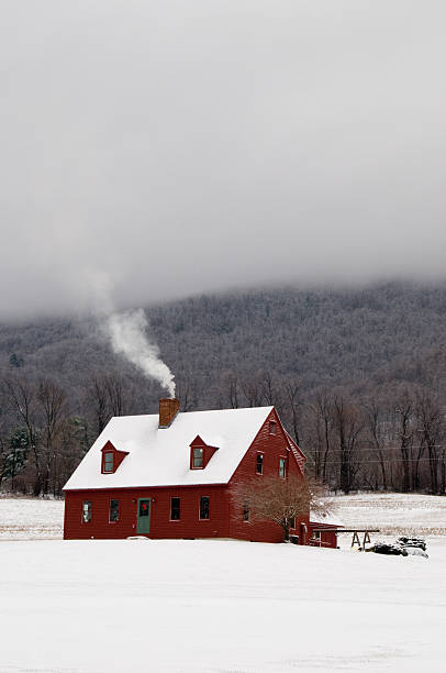 istock red vermont cape house in winter 147658744