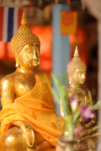 Two Buddhas sitting in a row