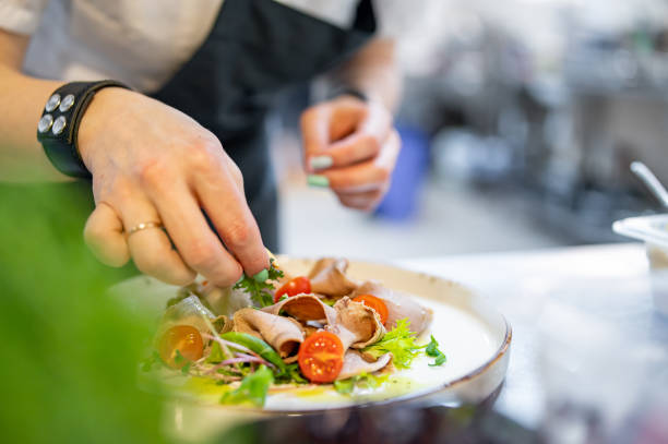 istock Chef cooking Beef tongue salad with fresh vegetables on restaurant kitchen 1476597270