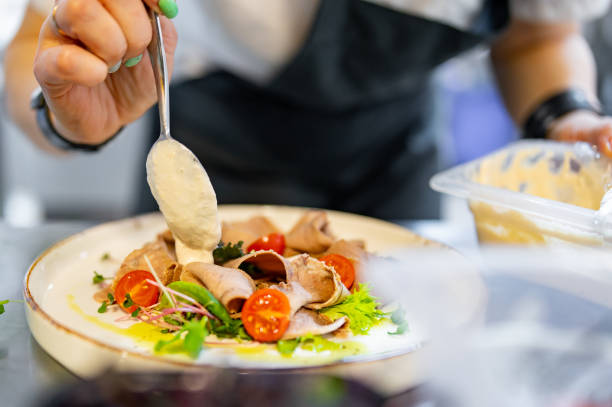 istock Chef cooking Beef tongue salad with fresh vegetables on restaurant kitchen 1476597276