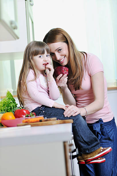 istock happy daughter and mom in kitchen 147660367