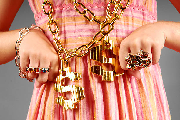 Young Girl Wearing Hiphop Jewelry Young girl wearing gawdy hip hop jewelry gangster rap stock pictures, royalty-free photos & images