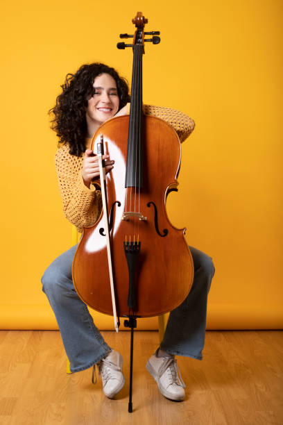 istock Casual girl posing with her violoncello 1476609421