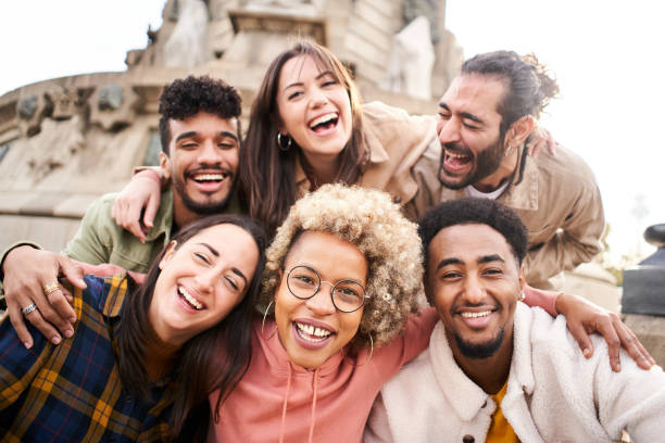 istock International students with beaming smiles are posing for selfie shot outdoors in university campus. Cheerful, smart and successful youth 1476609983