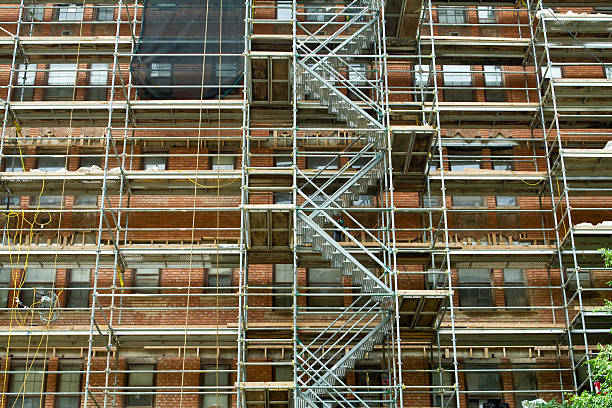 istock Full Frame Scaffolding On Old Red Brick Building Under Renovation 147661220