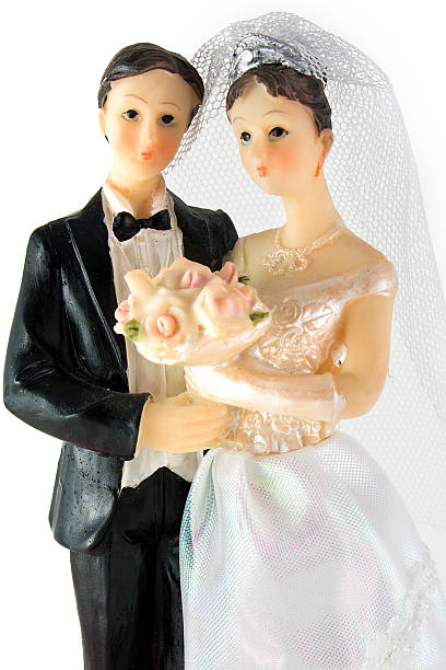 istock Bride and groom dolls wedding over white background 147661284