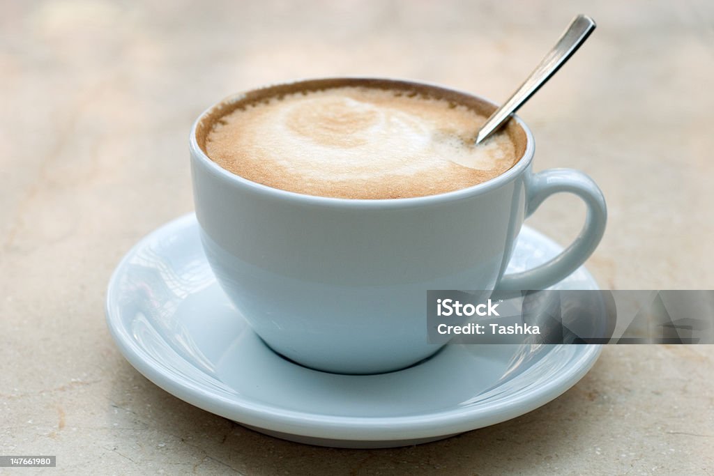 Cappuccino Cup of cappuccino on a table in Kiev indoor cafe Advertisement Stock Photo