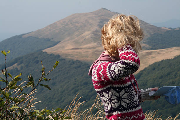 Fixing Hair on Top of the Mountain stock photo