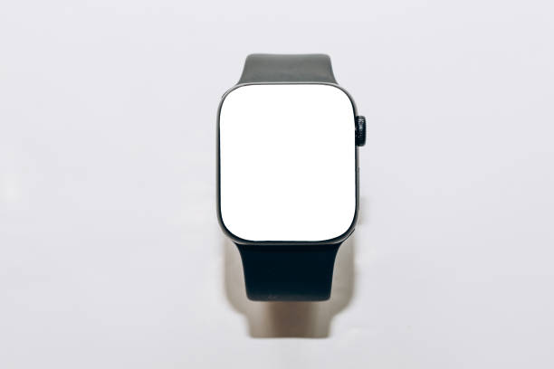 istock A black technological smart watch lies on a wooden background with a white screen for text space. 1476624786