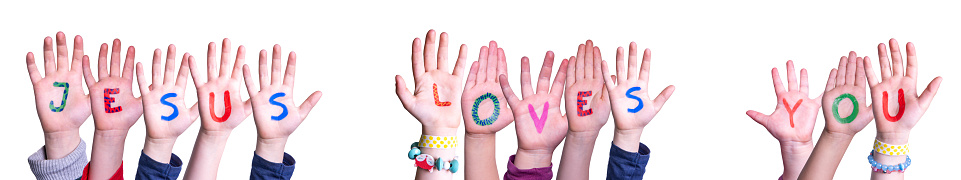 Children Hands Building Colorful English Word Jesus Loves You. Isolated White Background.