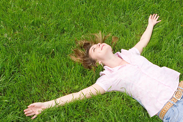 istock sweet woman rest on the grass 147663774